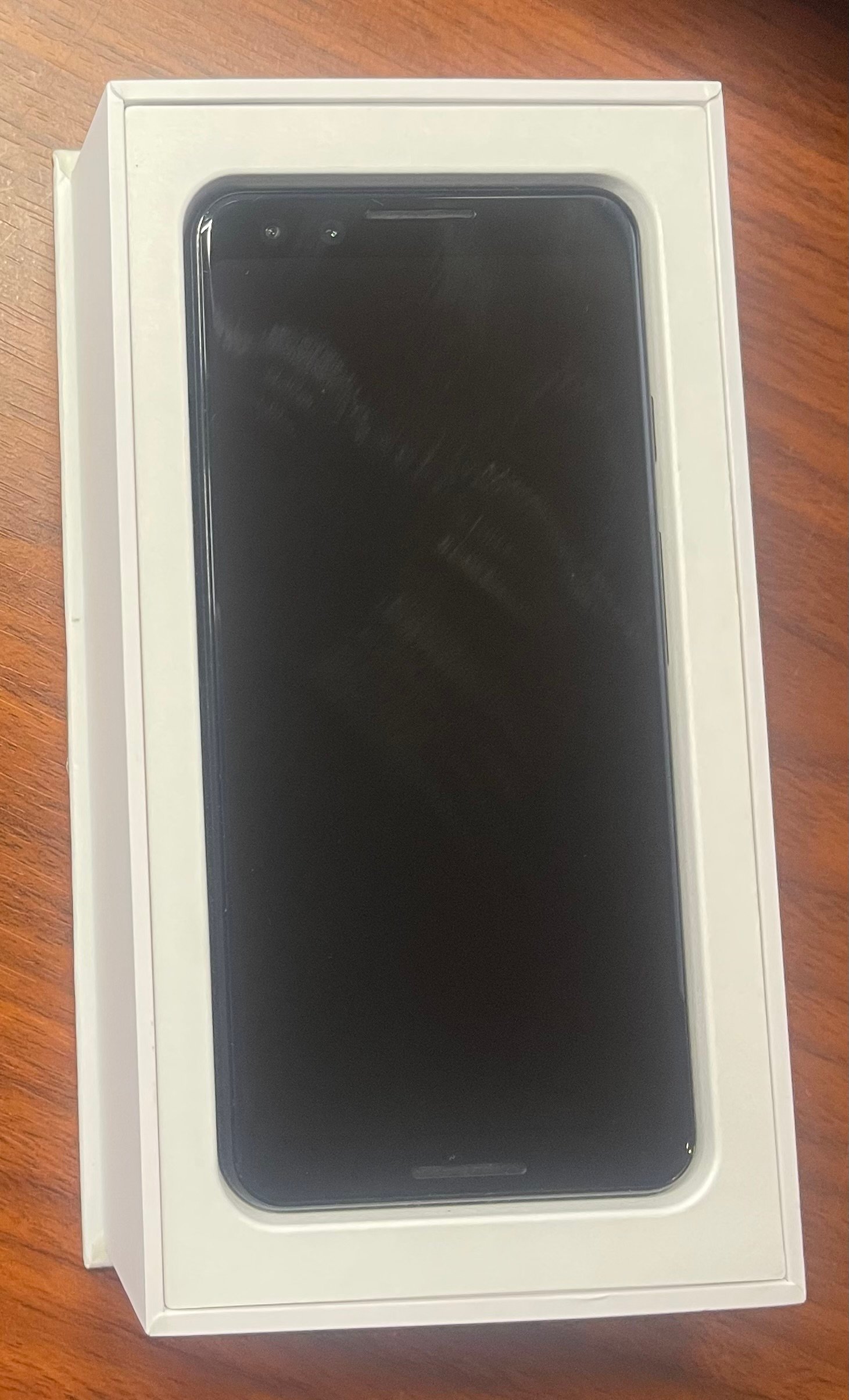 Google Pixel 3 actual phone front in original box Actual Google Pixel 3 front view in its original box; screen is off